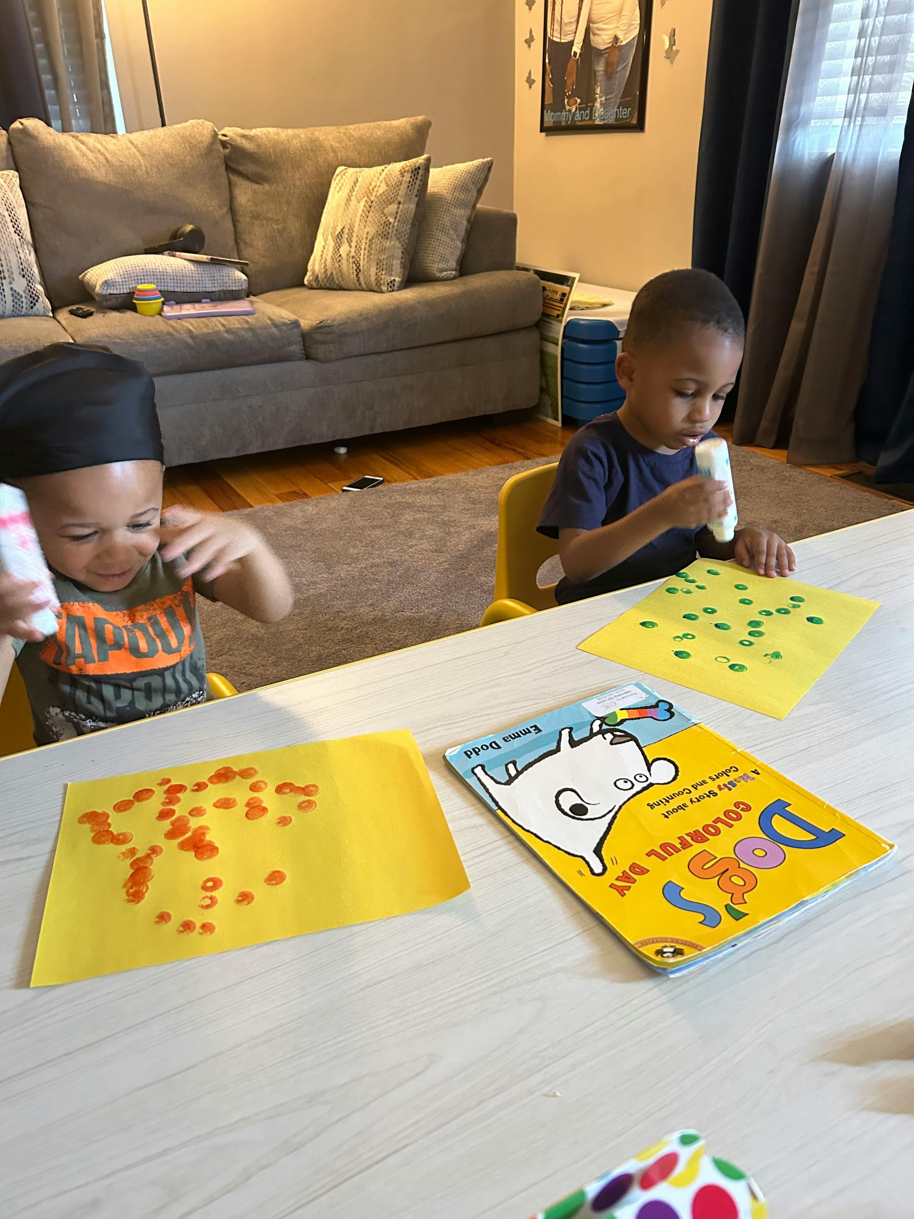 Two children doing crafts at a table
