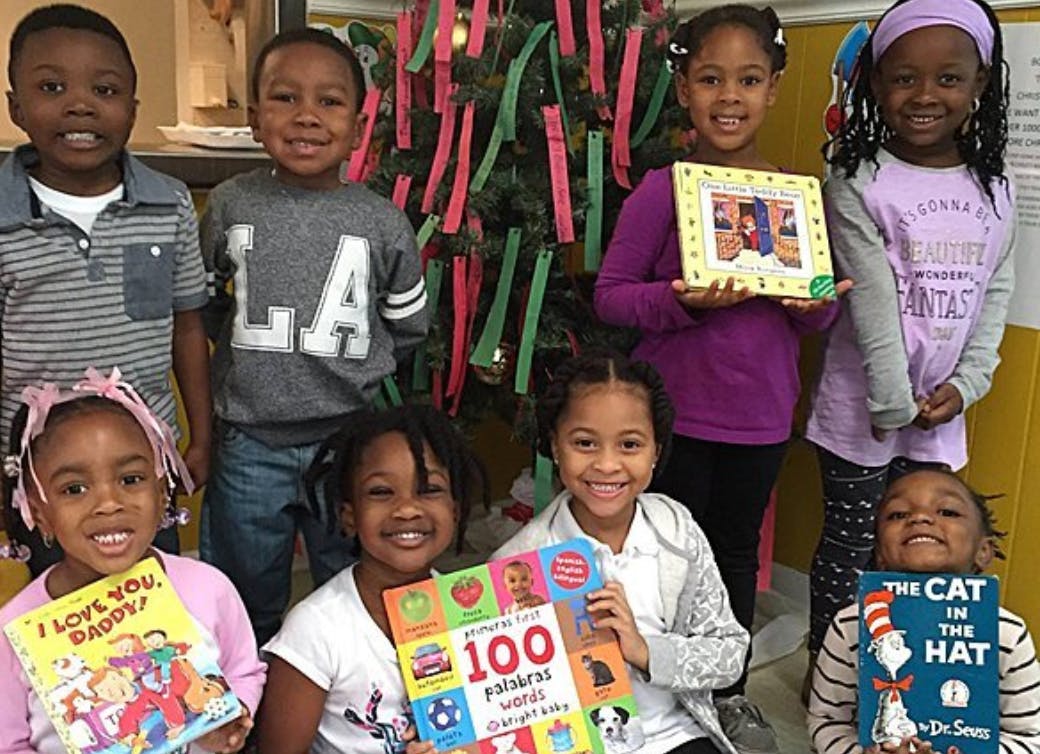 Group of children holding books
