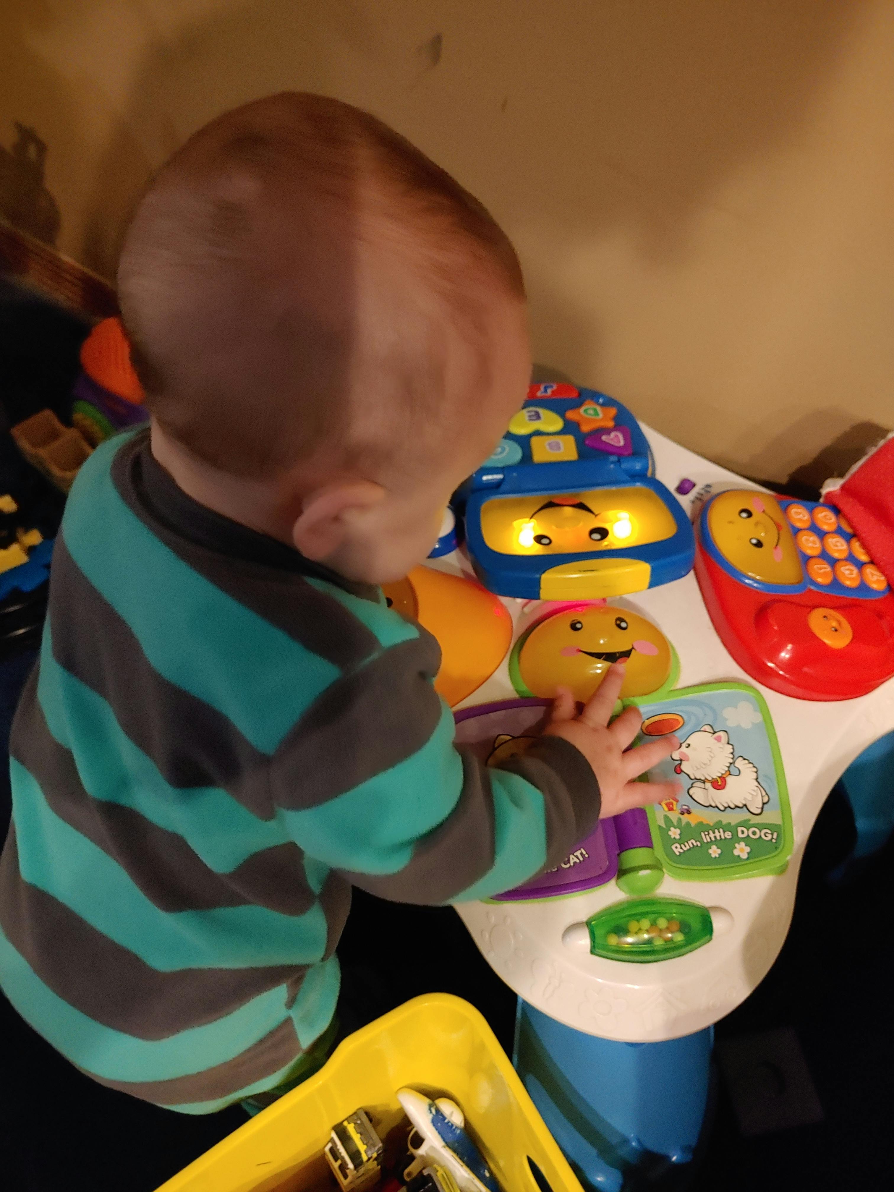 Child playing with a light-up toy
