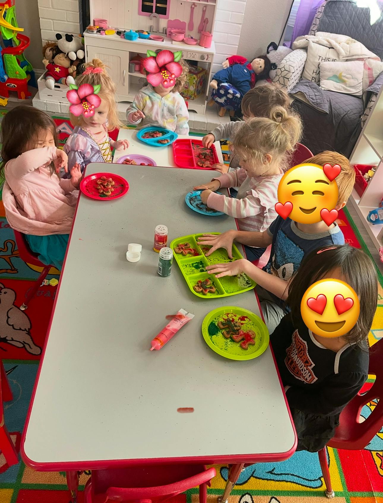 Children sitting at a table with plates of food