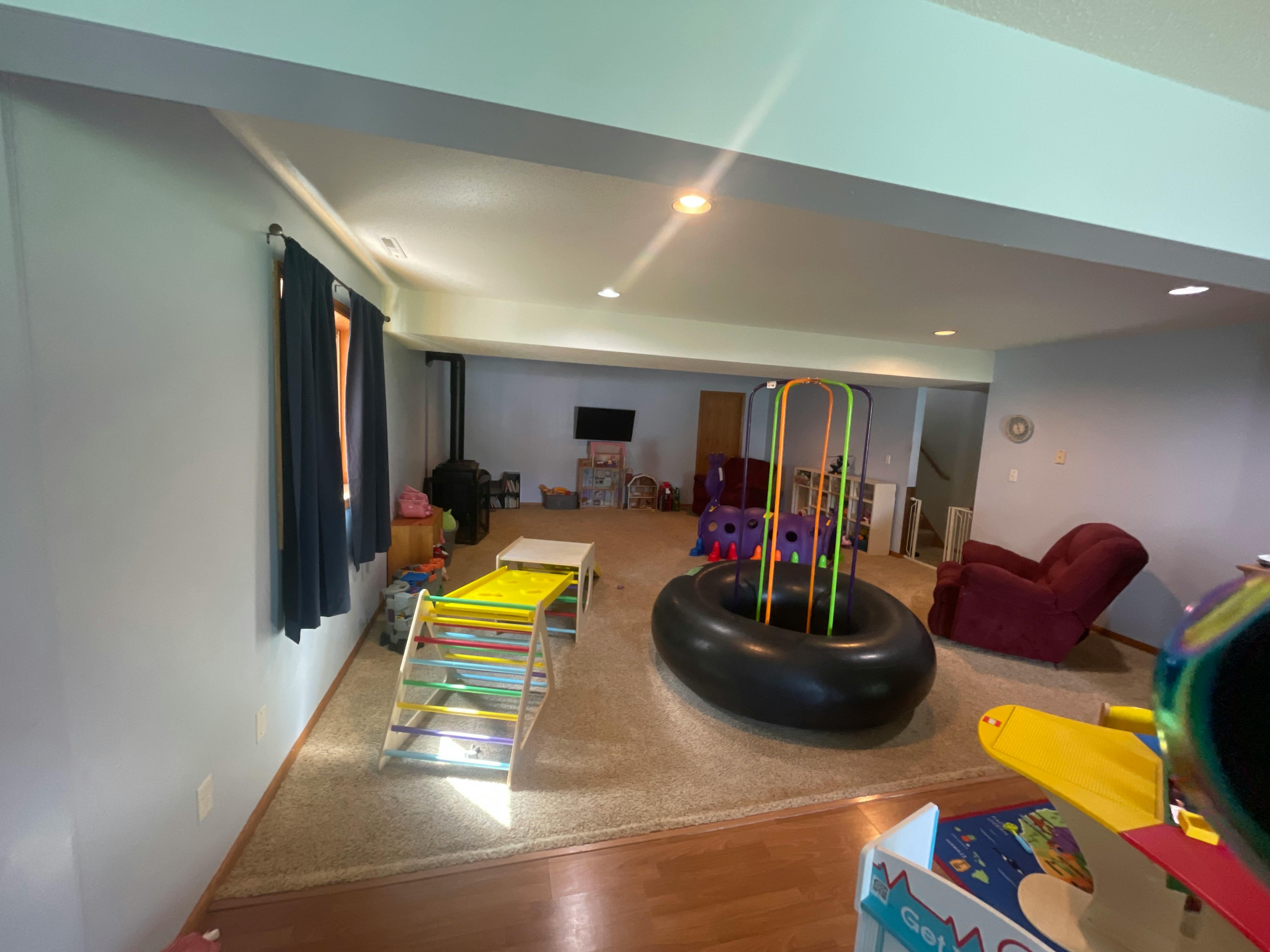 Indoor play area with various play equipment
