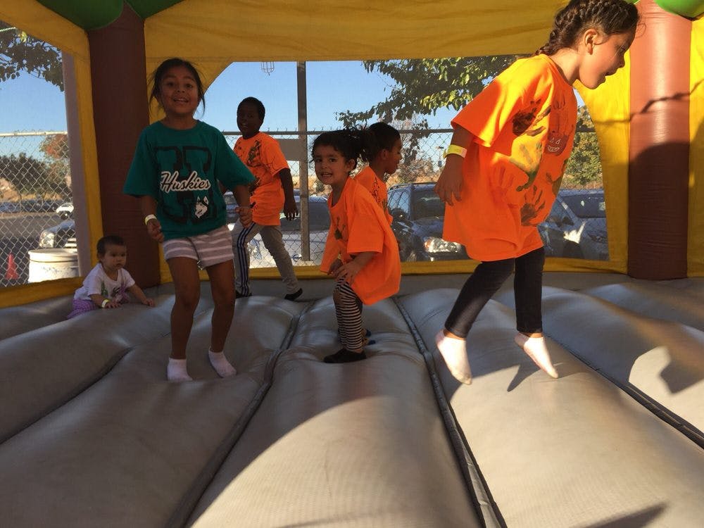 Children jumping in an inflatable bounce house
