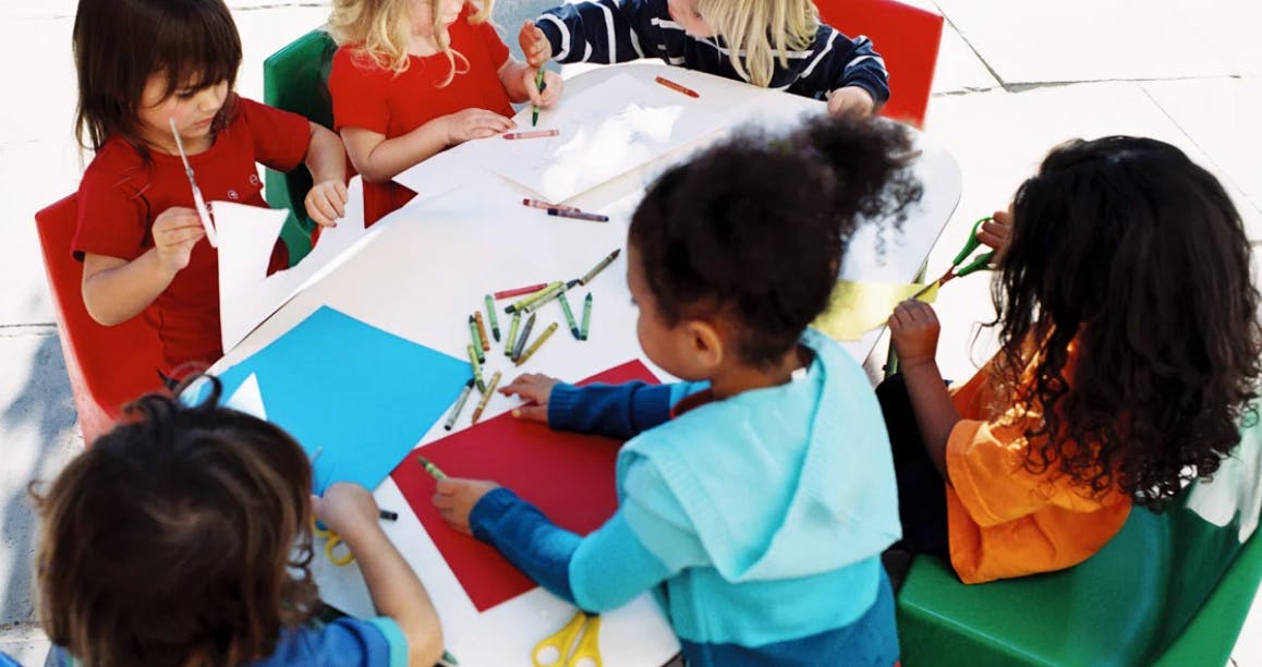 Children doing crafts at a table