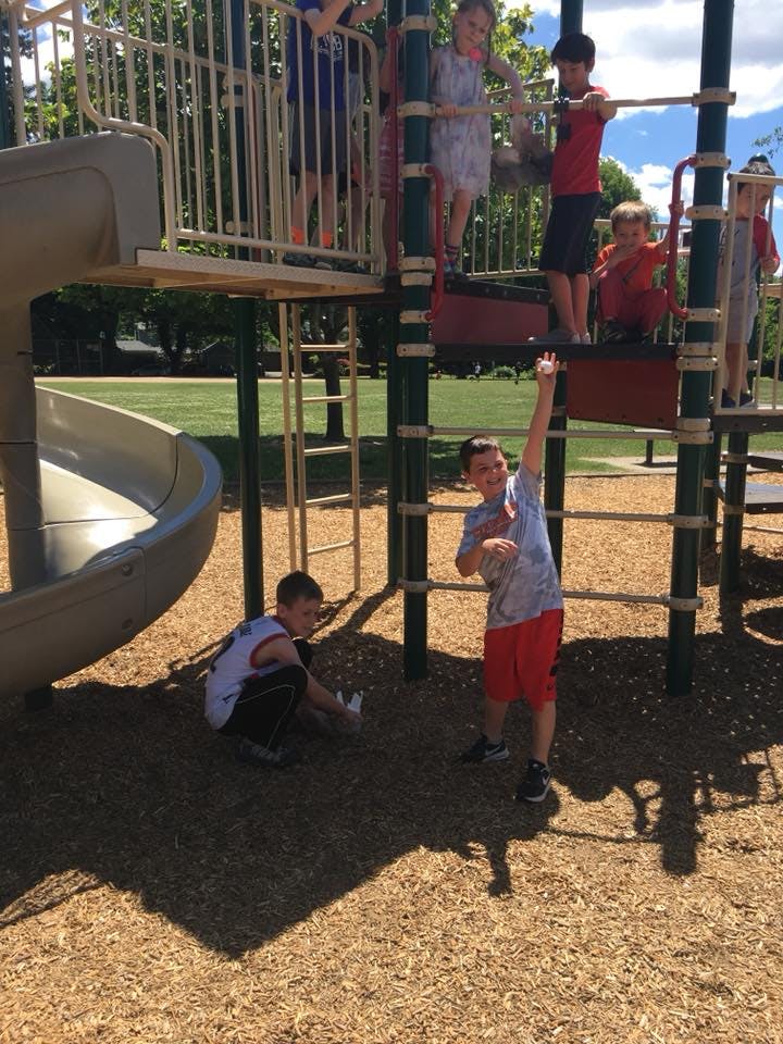 Children playing on a playground structure