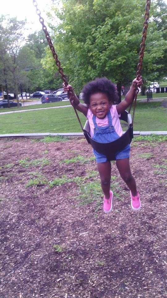 Child on a swing at a playground