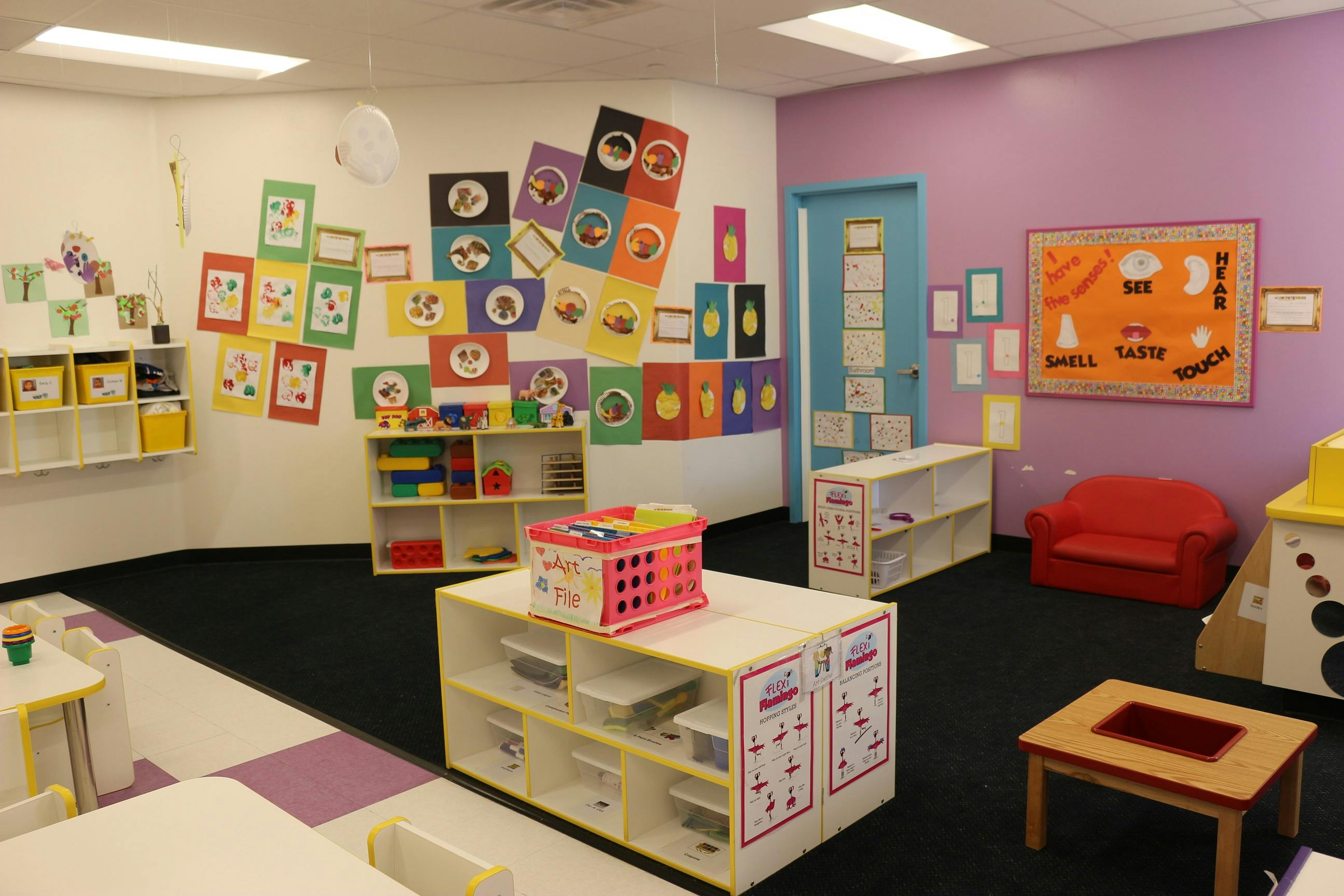 Classroom with colorful decorations and child-sized furniture