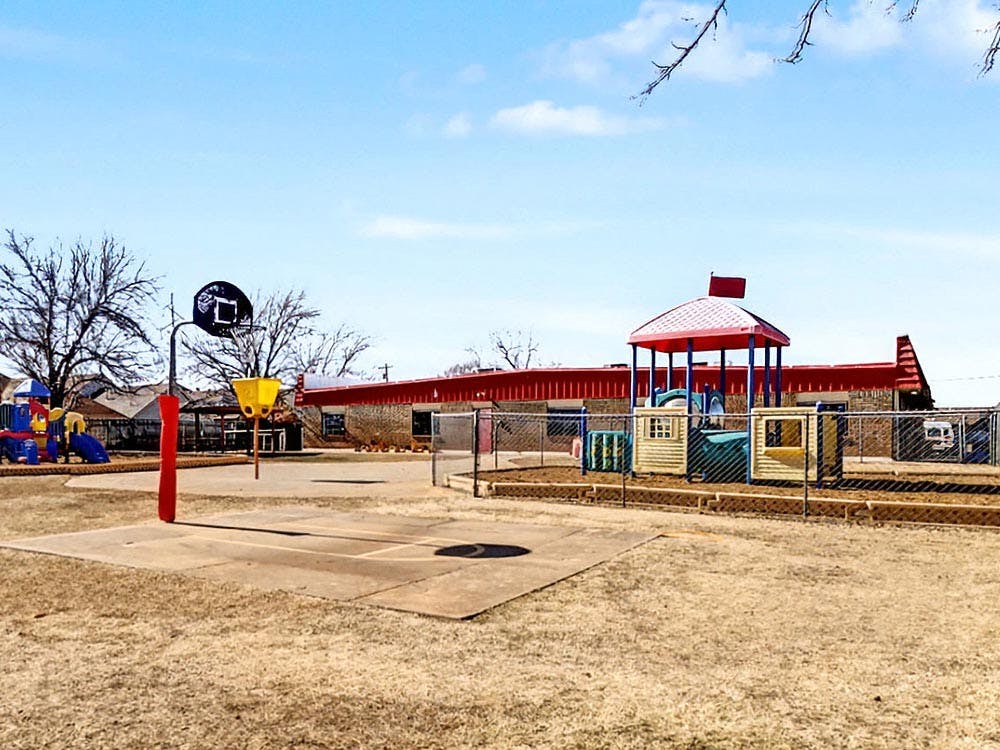 Basketball hoop and playground equipment in an outdoor area
