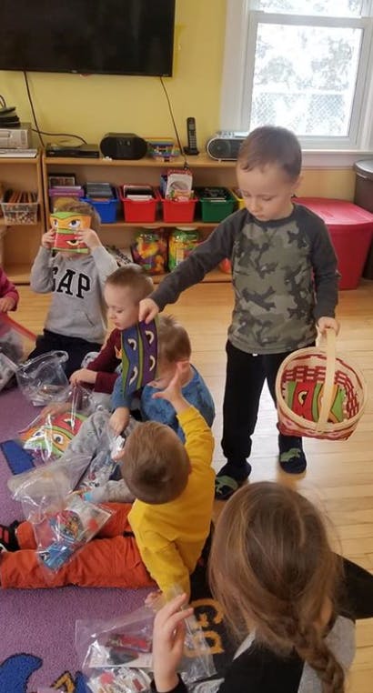 Children playing on the floor in a classroom
