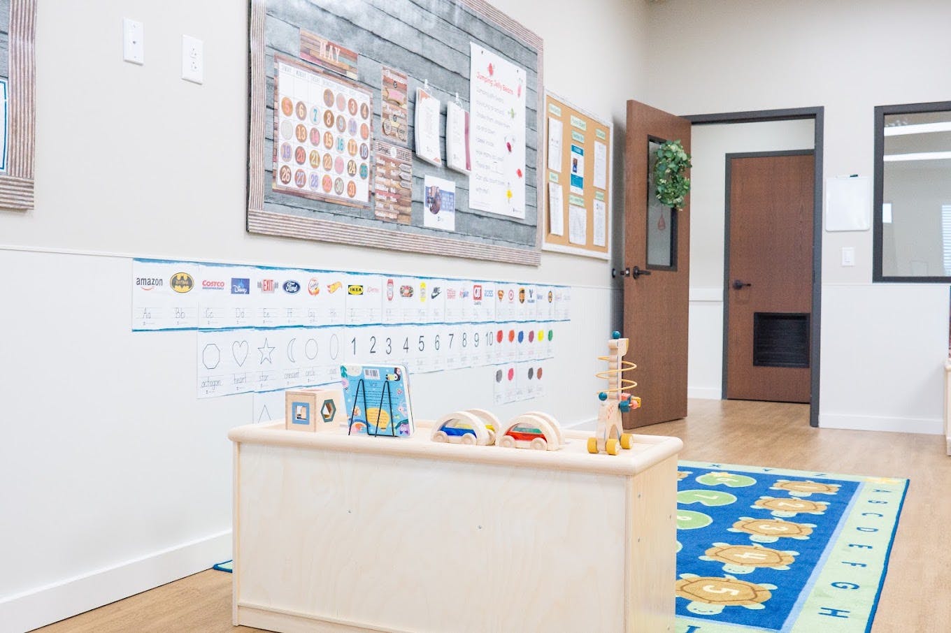 Educational posters and wooden toys in a child care classroom