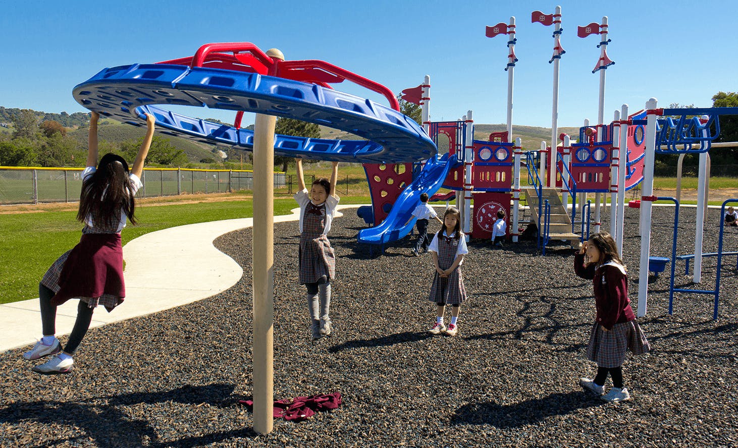 Children playing on playground equipment
