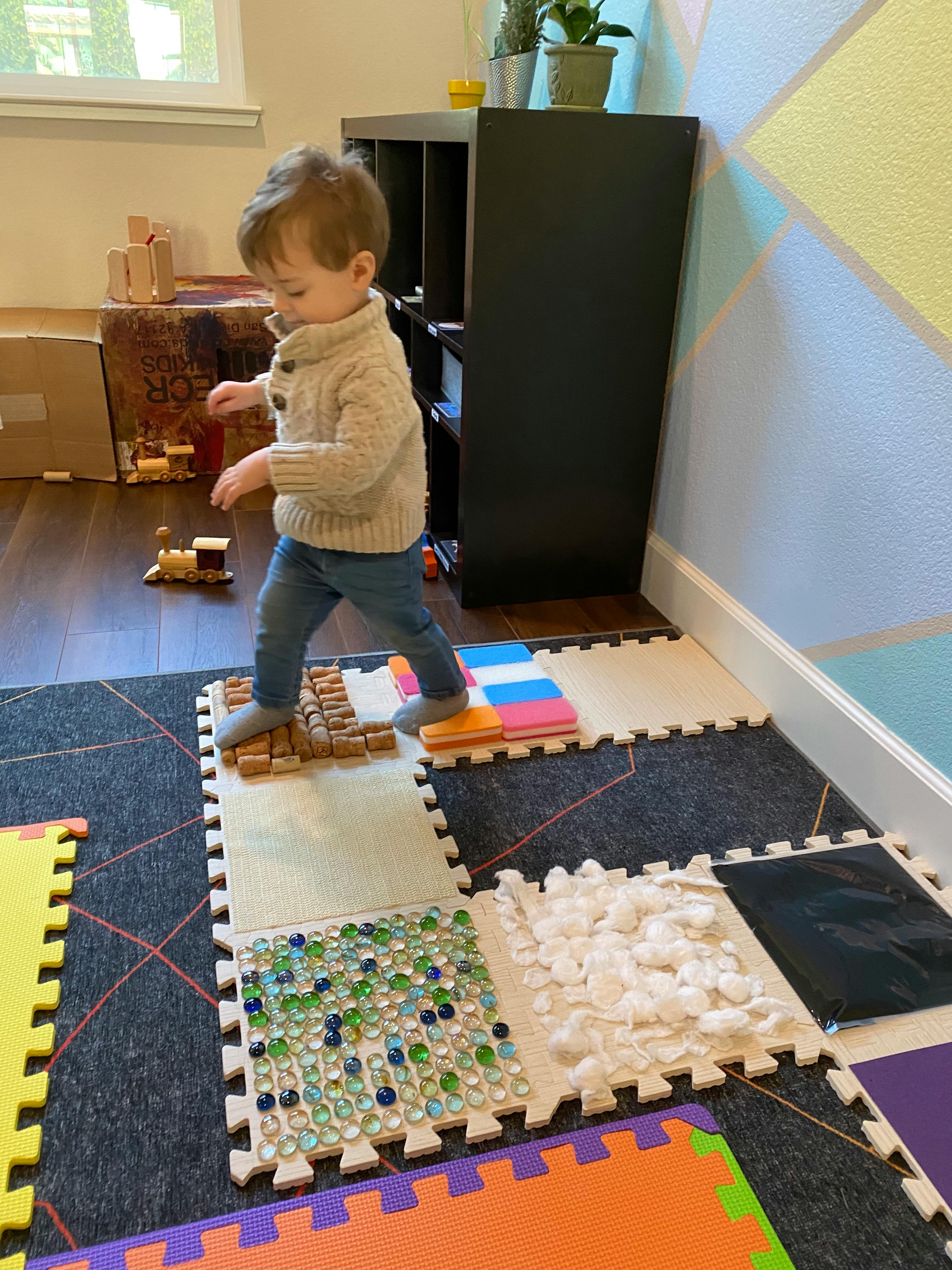 Child walking on sensory floor tiles