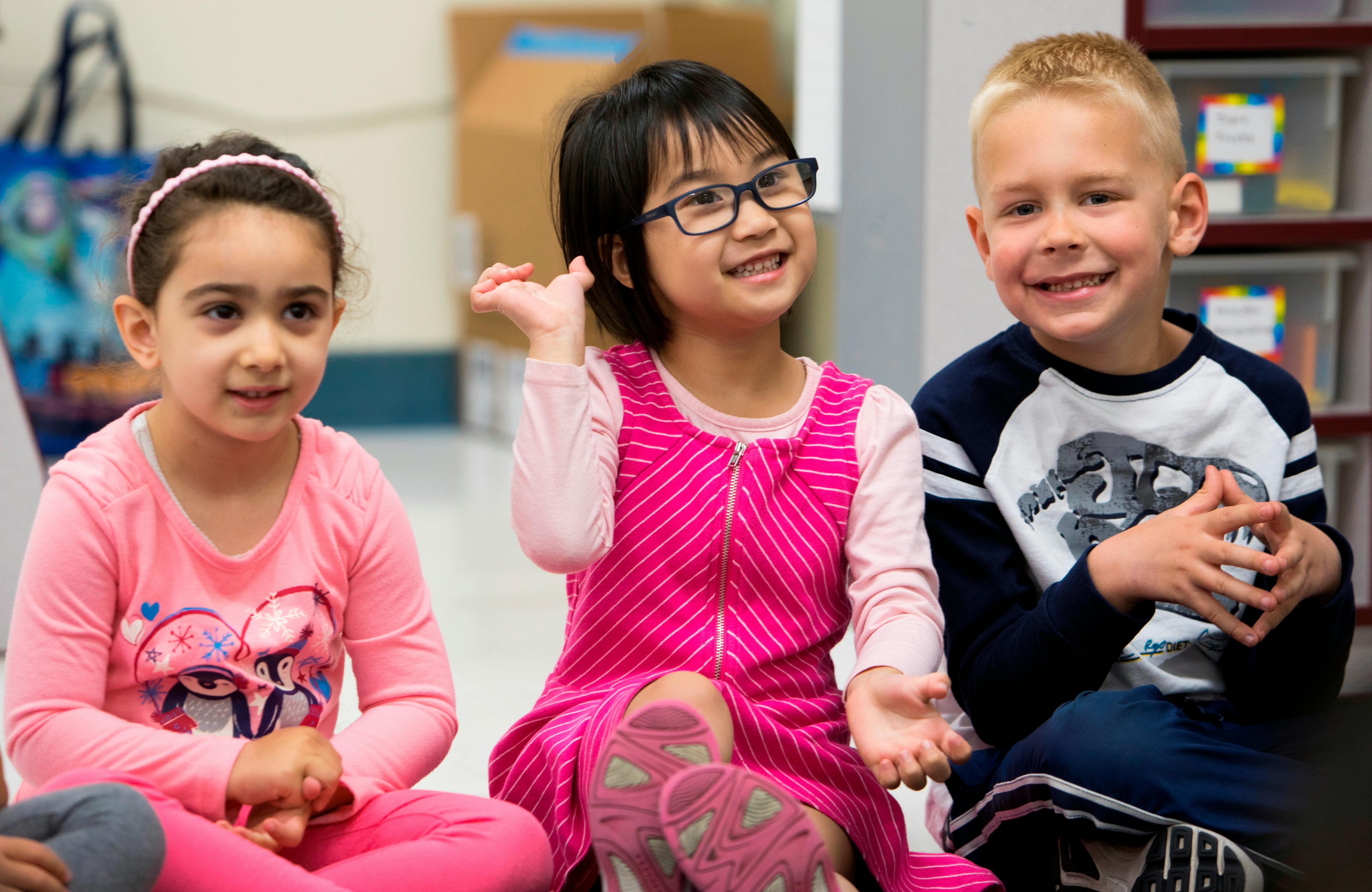 Three children sitting together