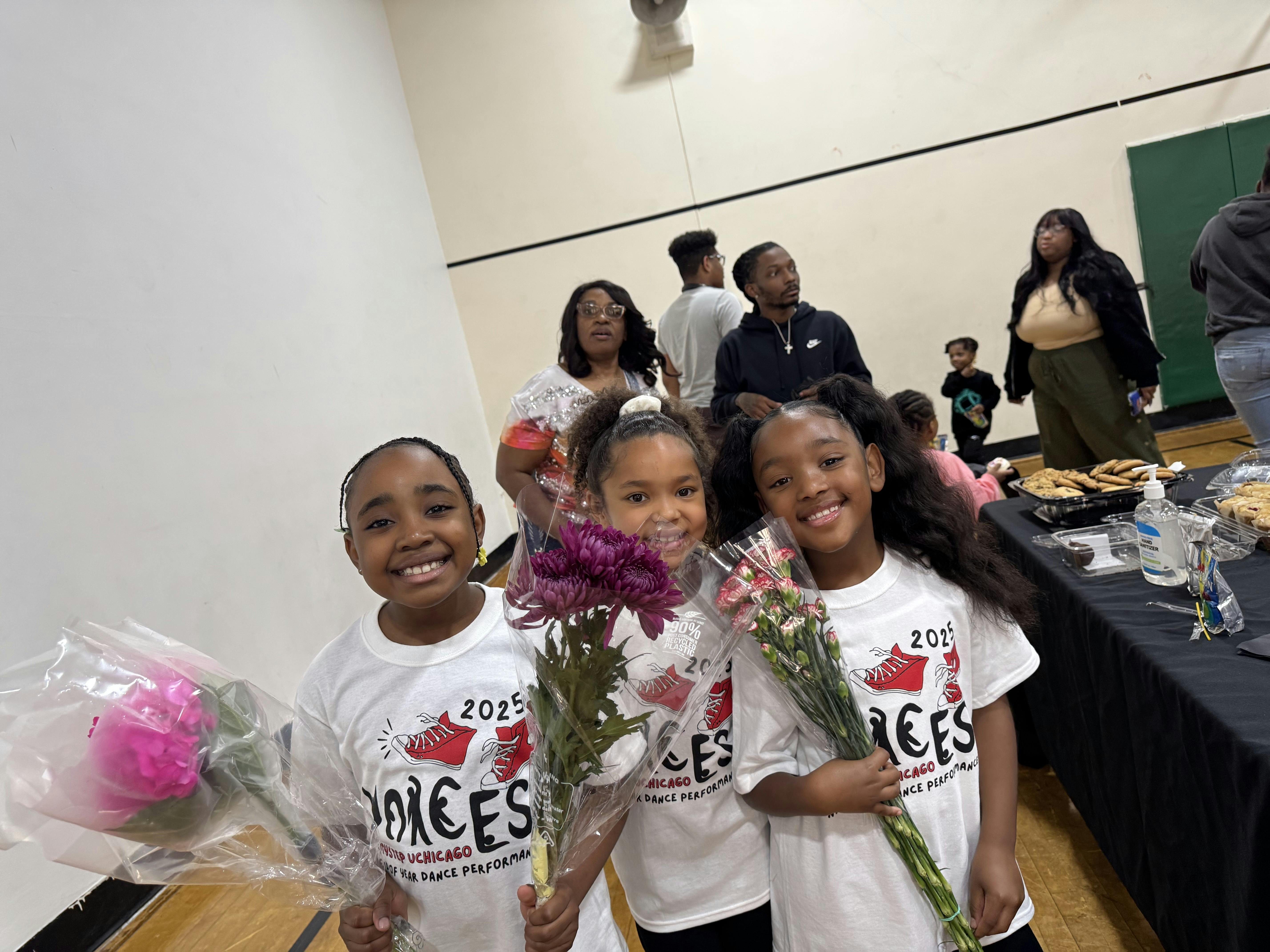Three children holding flowers