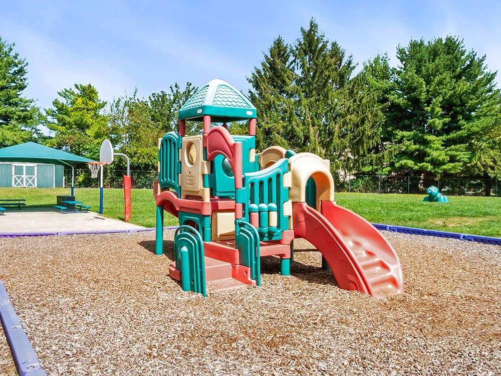 Playground with slides and structures on wood chips