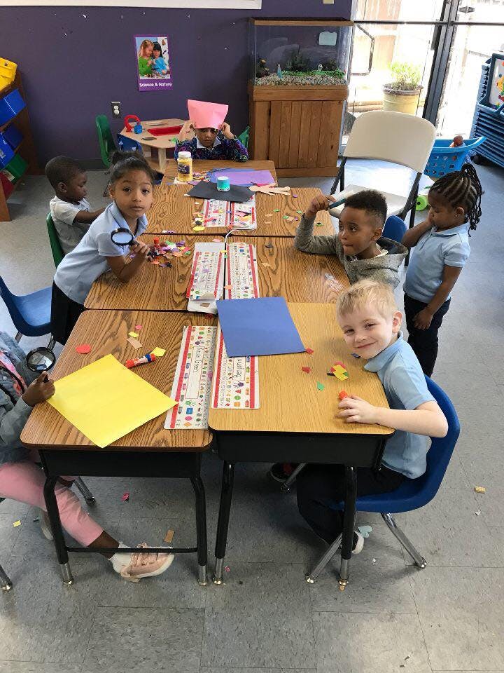 Children sitting at desks in a classroom