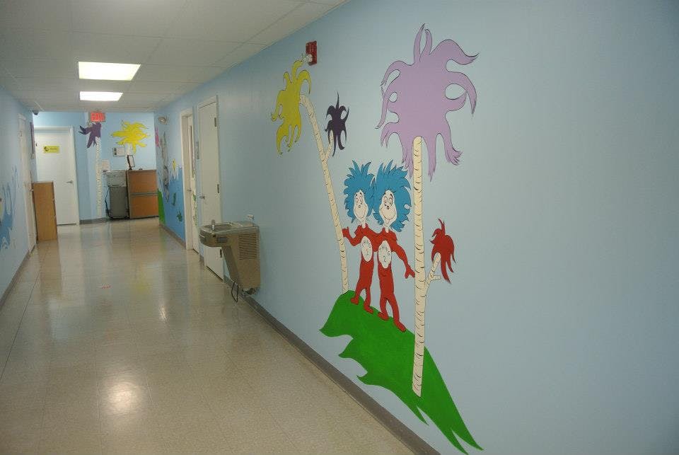 Hallway with cartoon characters painted on the wall