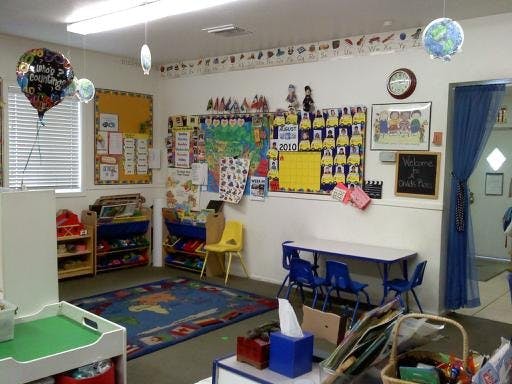 Classroom with colorful decorations, small tables, and chairs