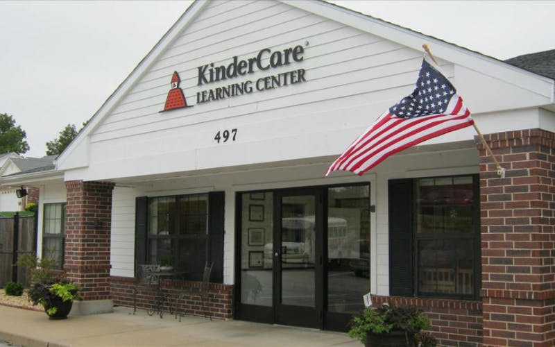 KinderCare Learning Center building with an American flag displayed