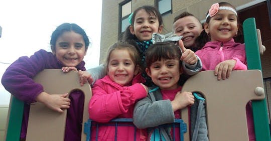 Group of children on playground equipment