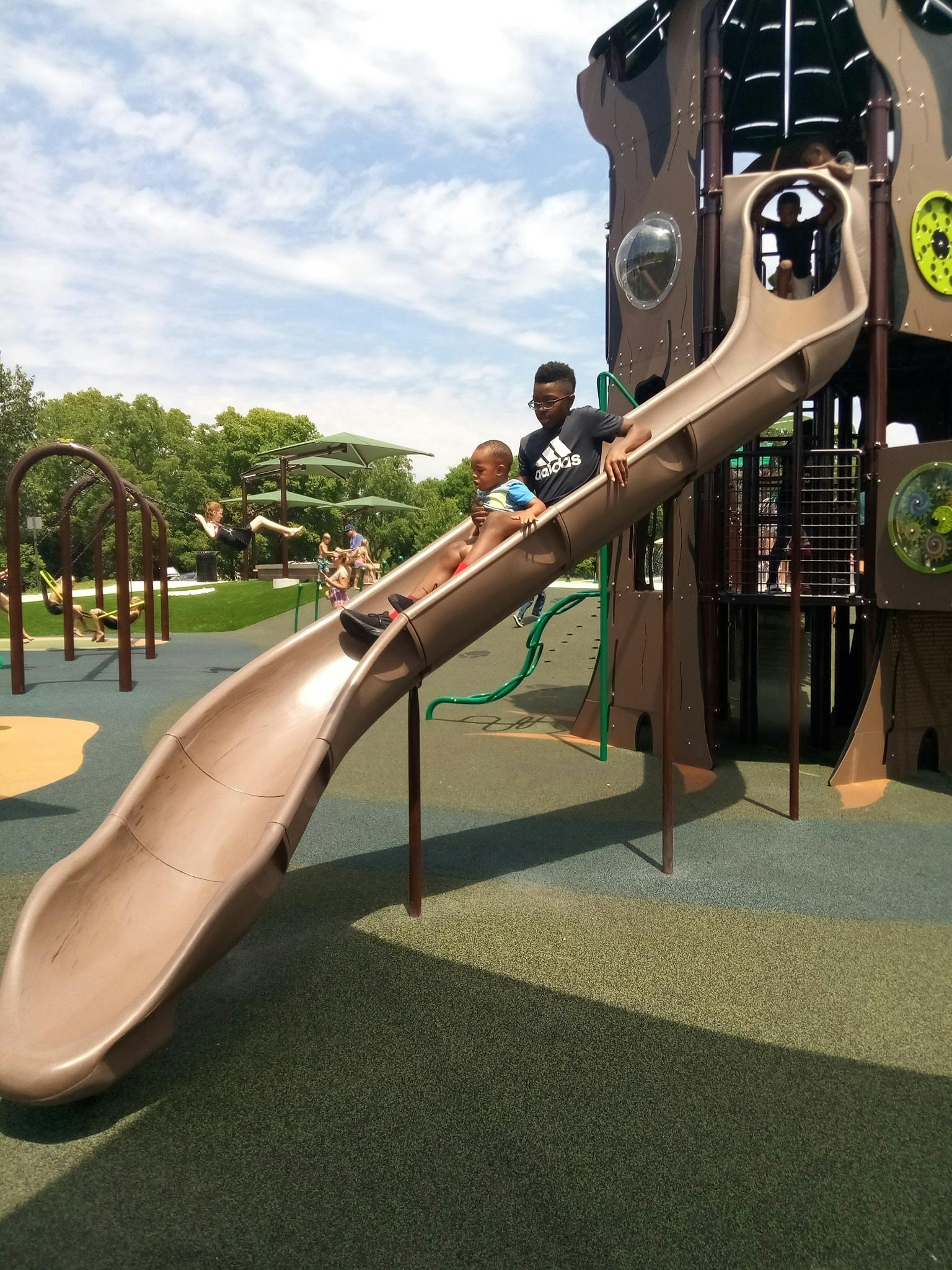 Two children on a playground slide