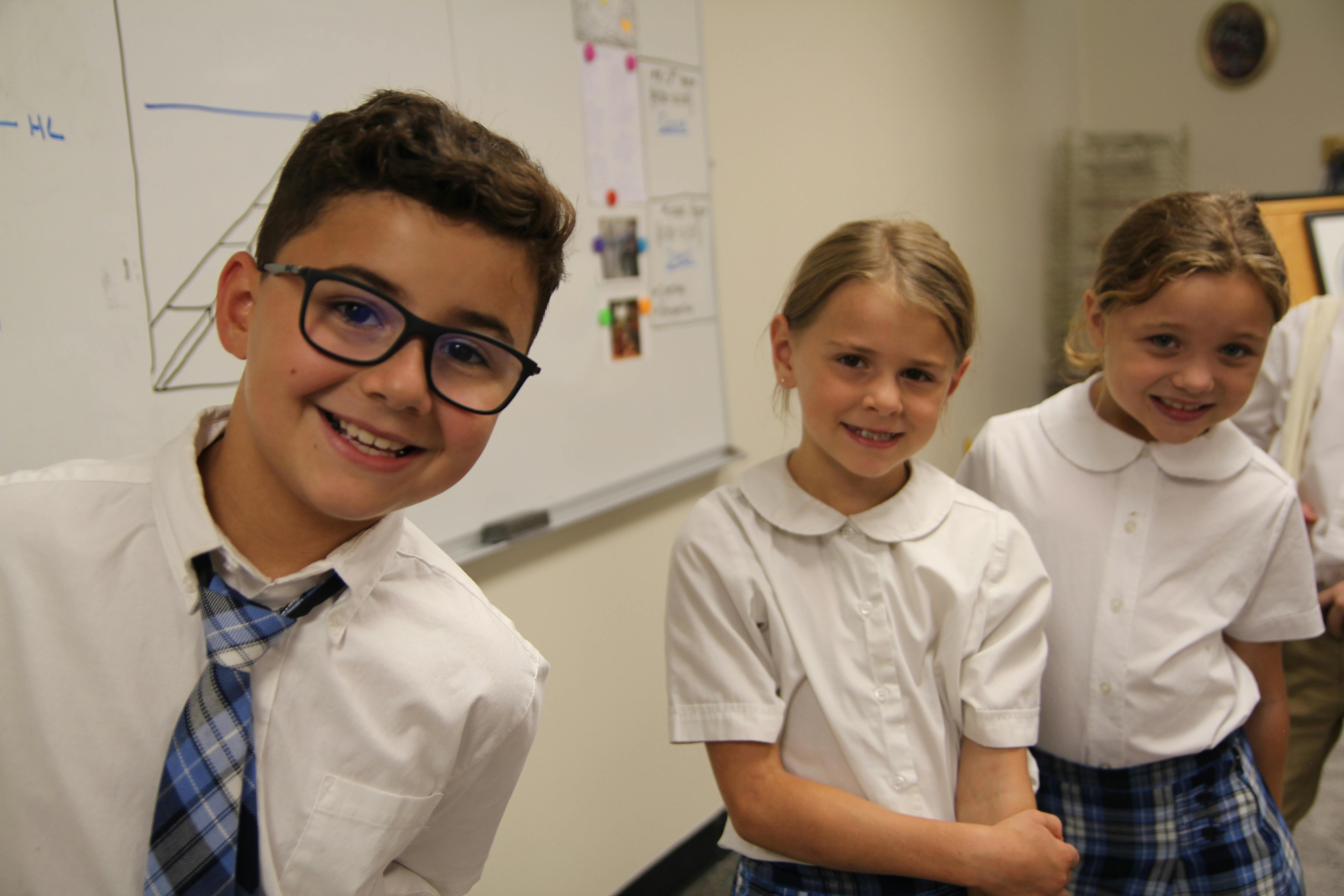Three children in a classroom