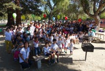Large group of people and children gathered outdoors
