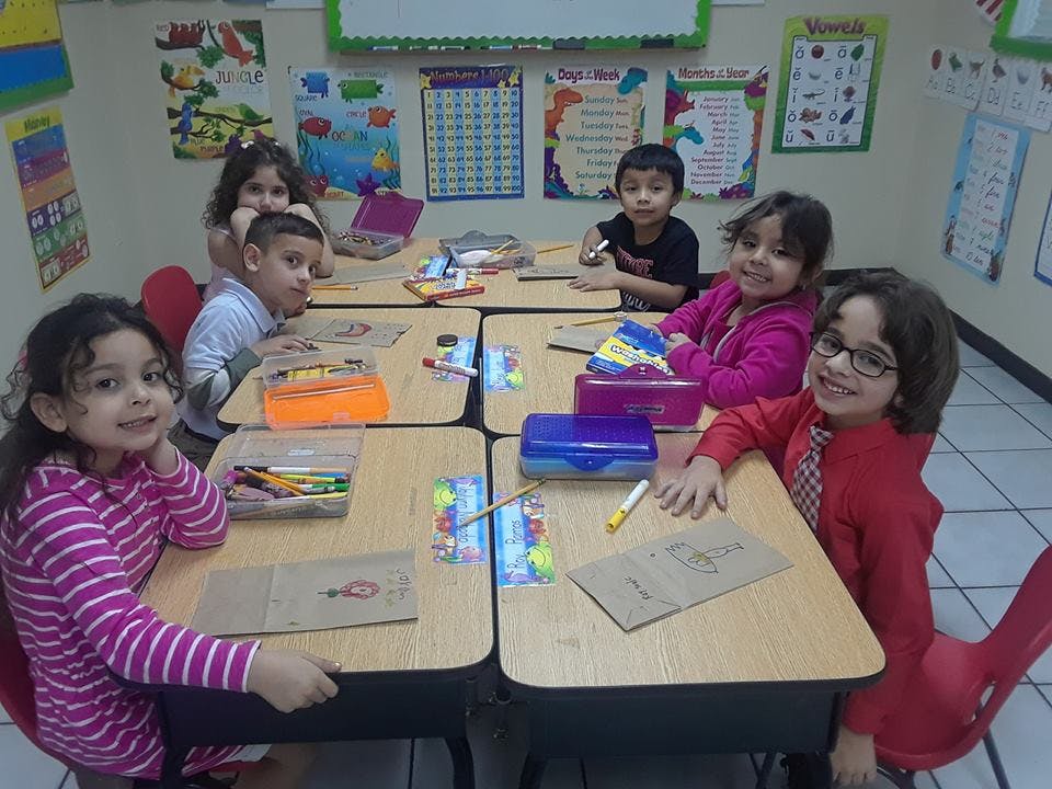 Children sitting at desks in a classroom