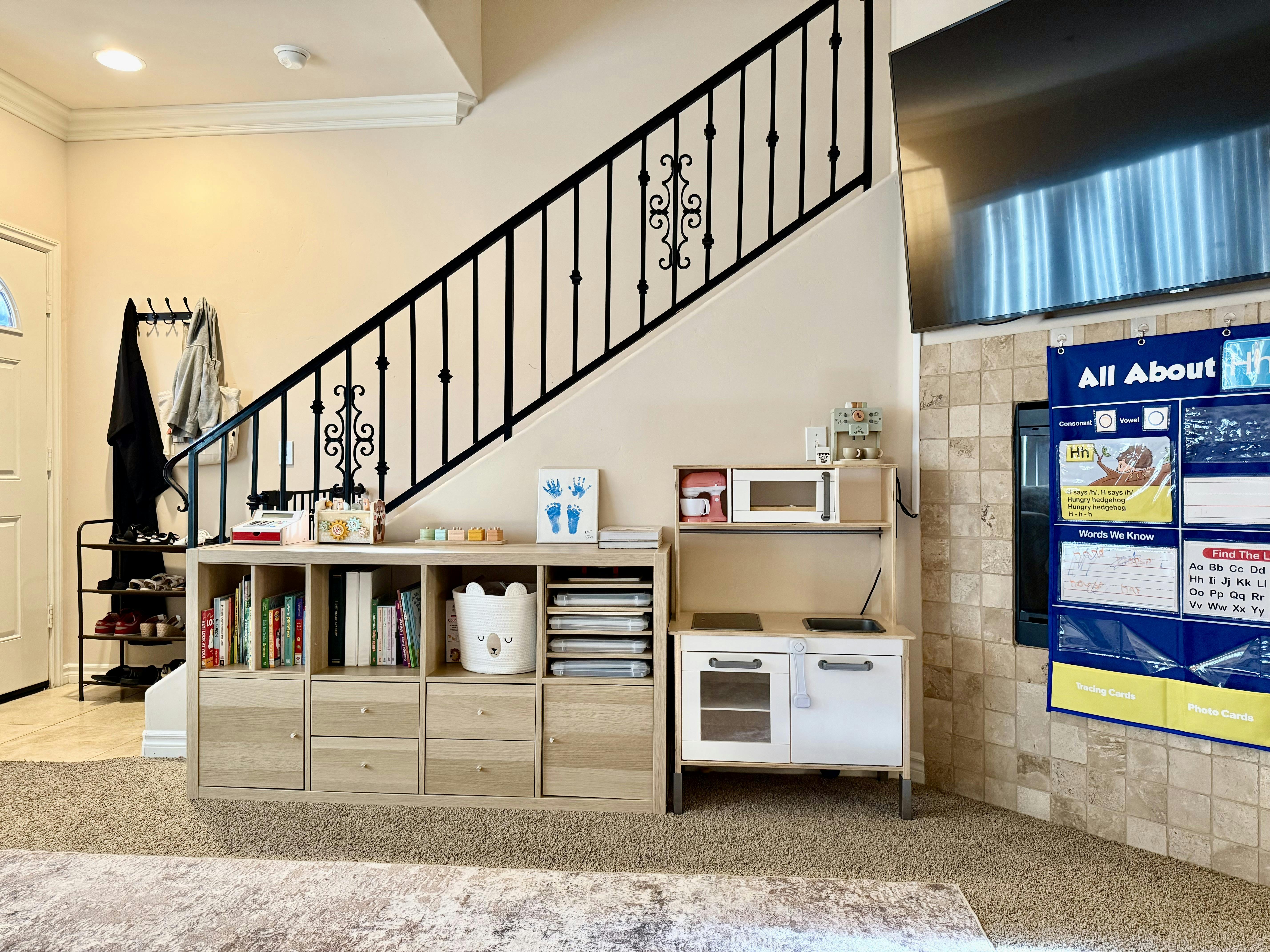 Toy kitchen and storage shelving in a home living space