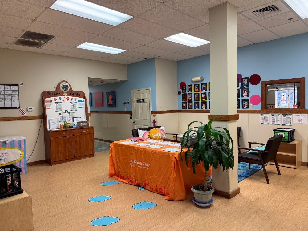 Lobby of a daycare or preschool with a "Parent Center" sign and orange table