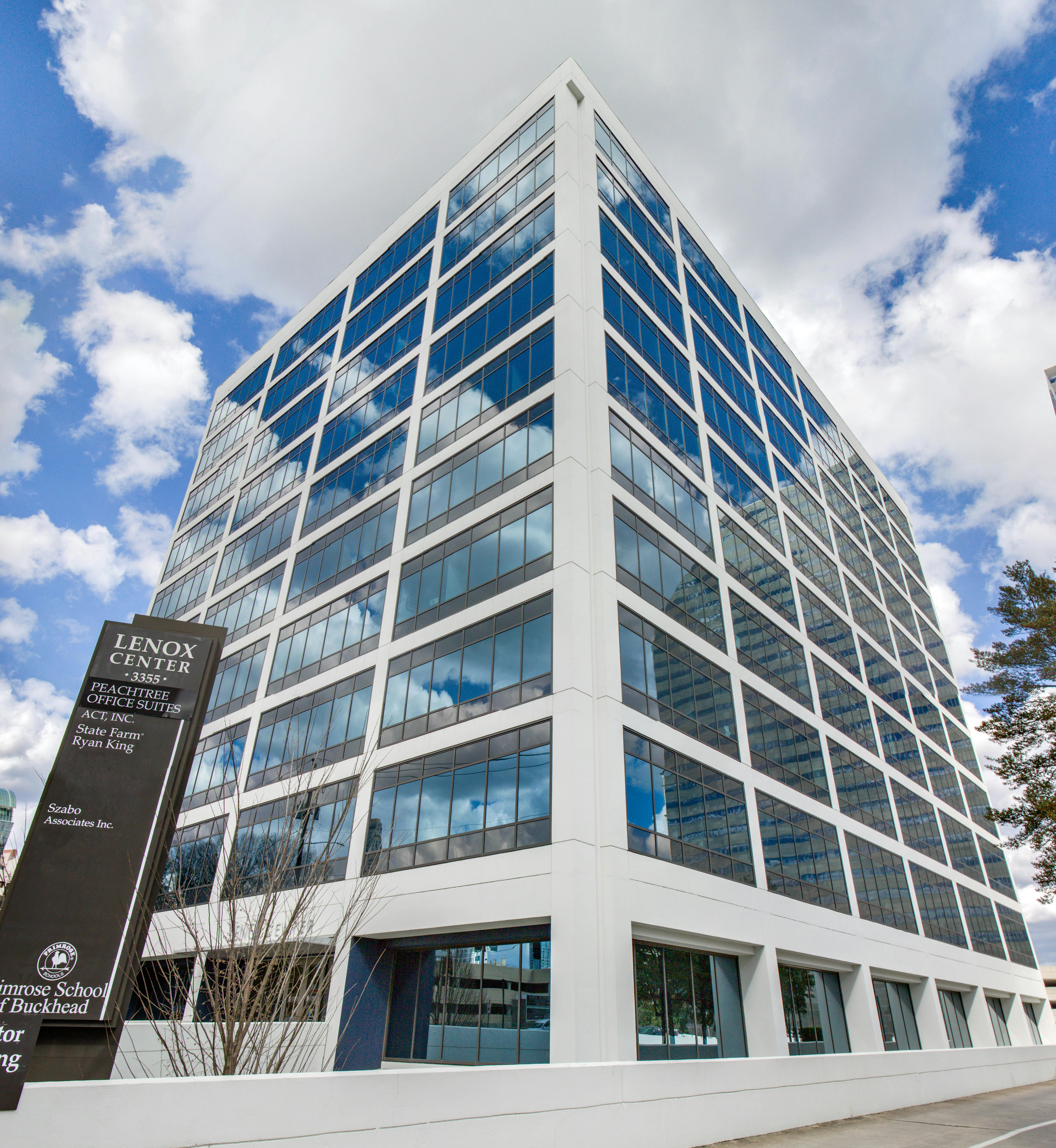 High-rise building with a sign that reads "Lenox Center" and several company names