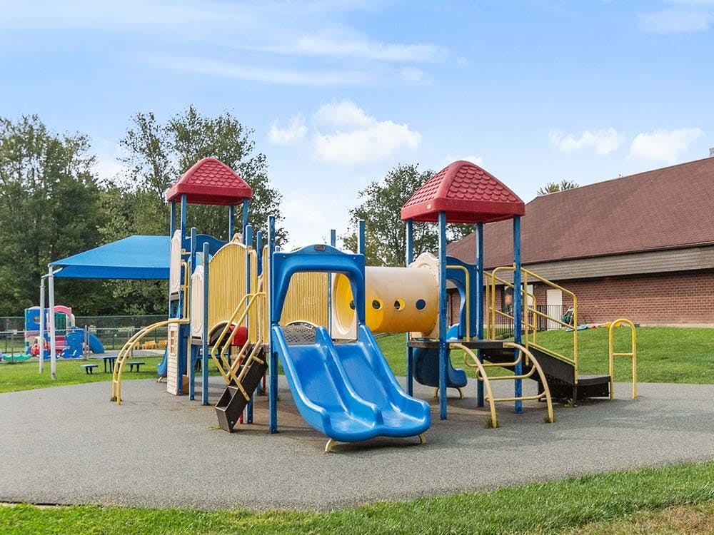 Colorful outdoor playground with slides and climbing structures