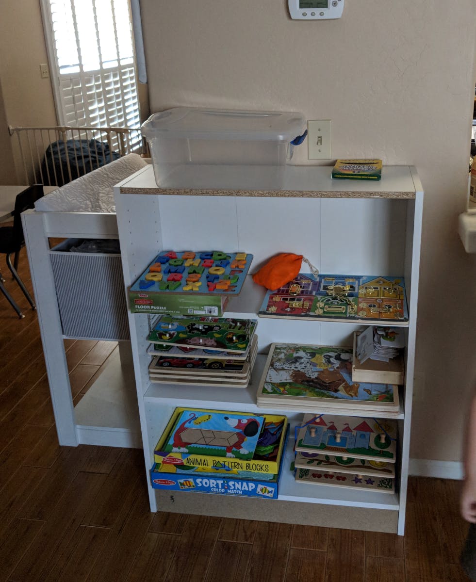Shelf with various puzzles and educational toys