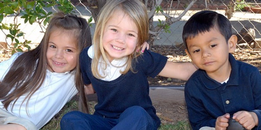 Three children sitting together