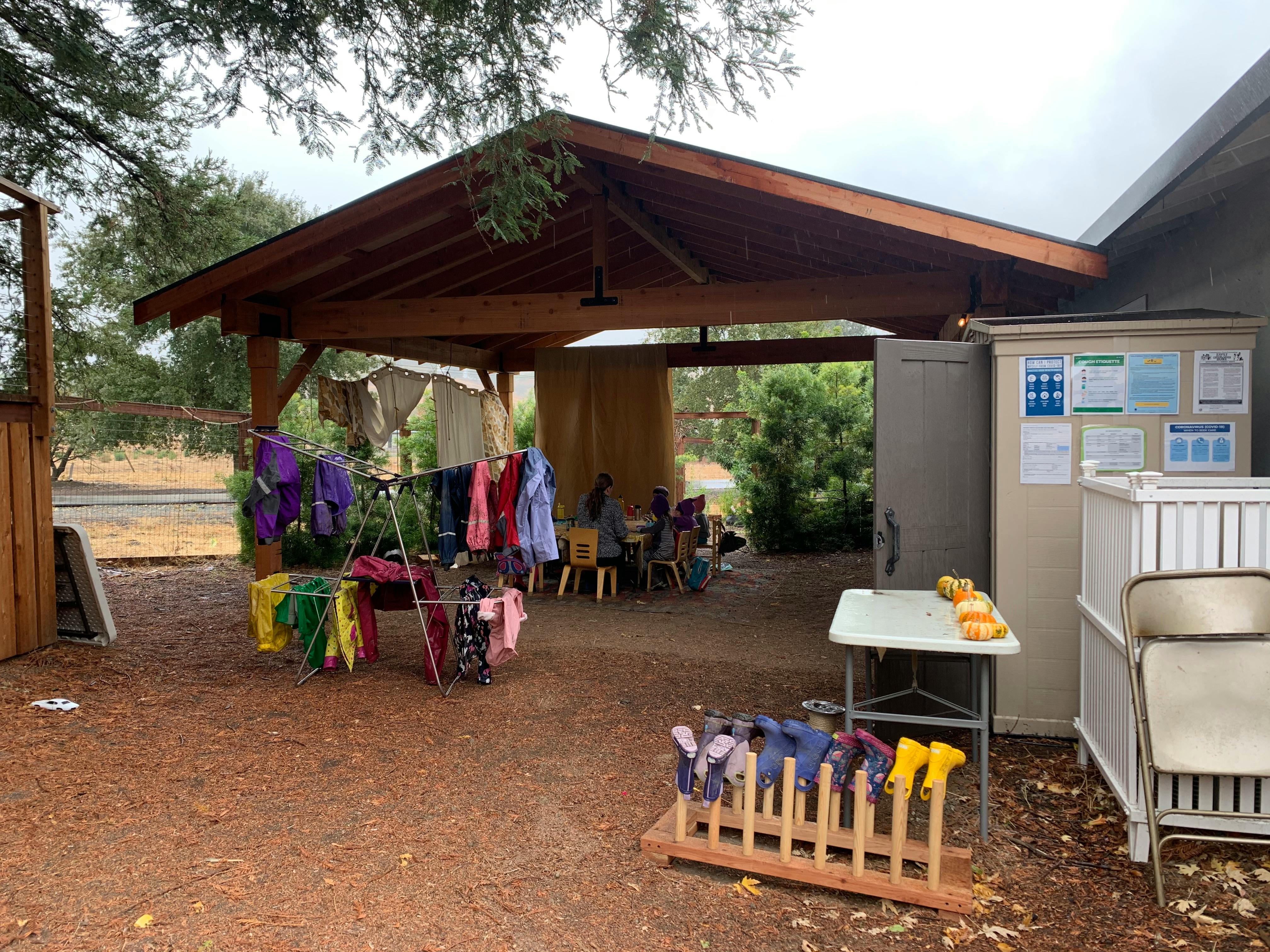 Clothes drying on a rack under a covered patio