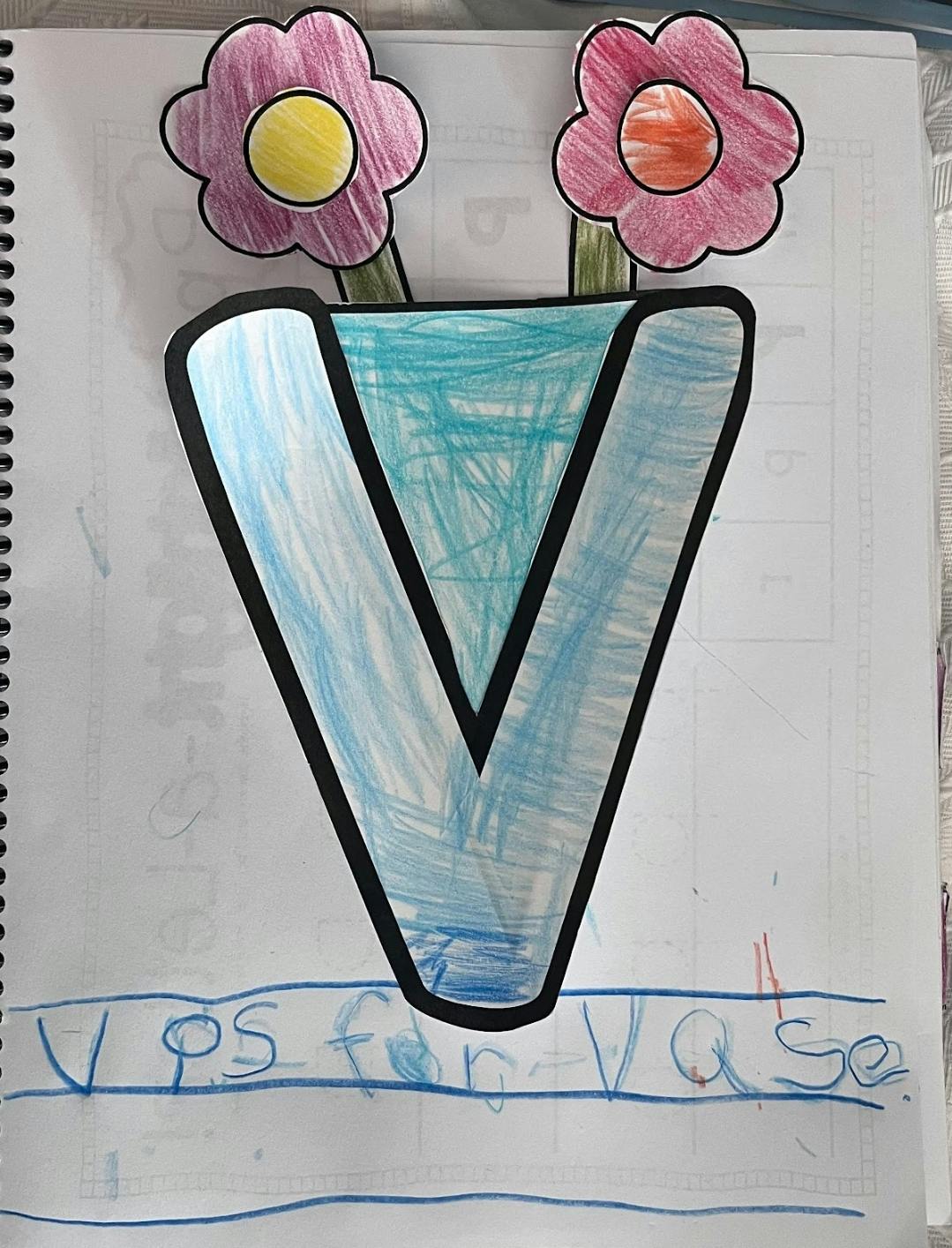 Child's drawing of a letter V as a vase with two flowers