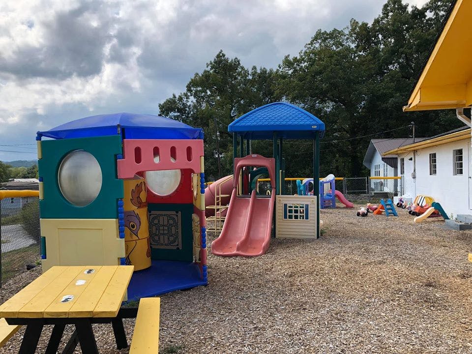 Playground with colorful play structures and slides
