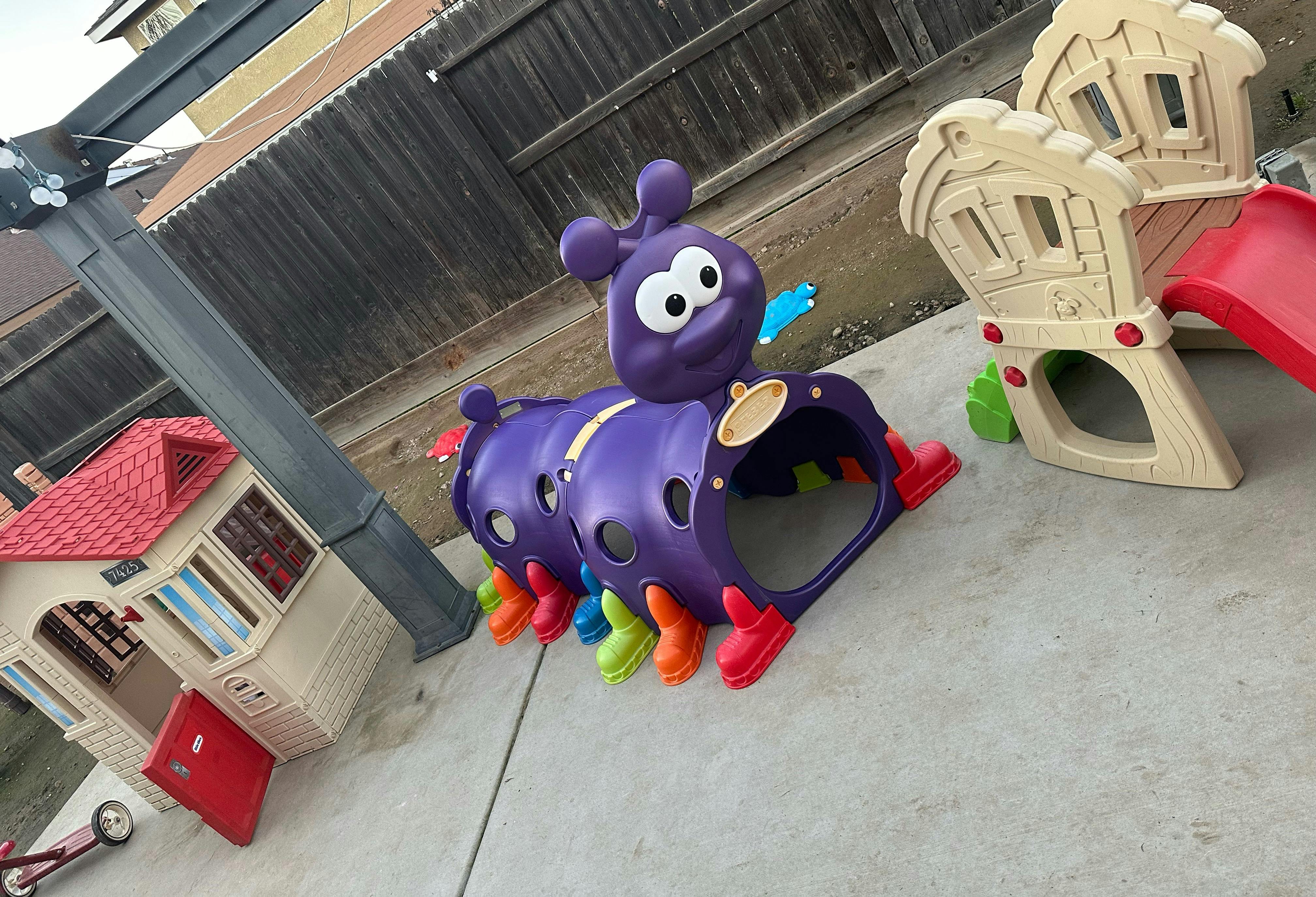 Purple caterpillar tunnel and small playhouse with slide