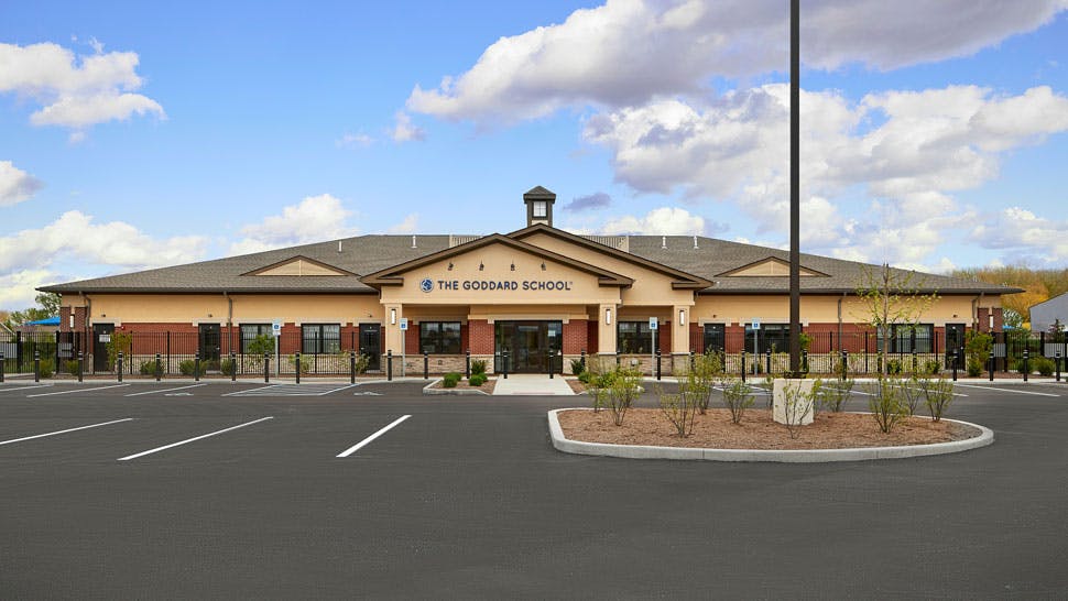 Building with "The Goddard School" sign and parking lot