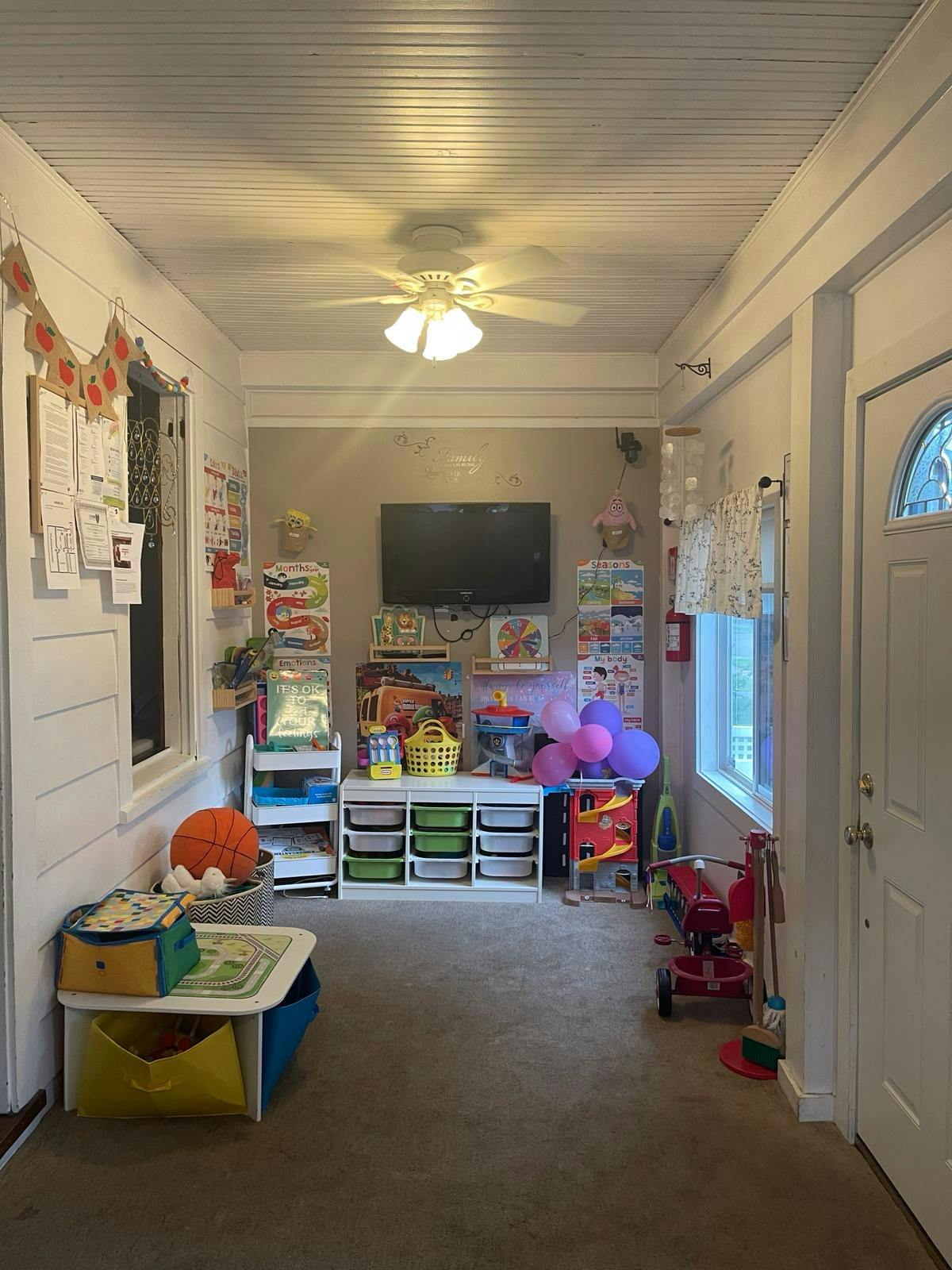 Hallway with children's toys and storage units