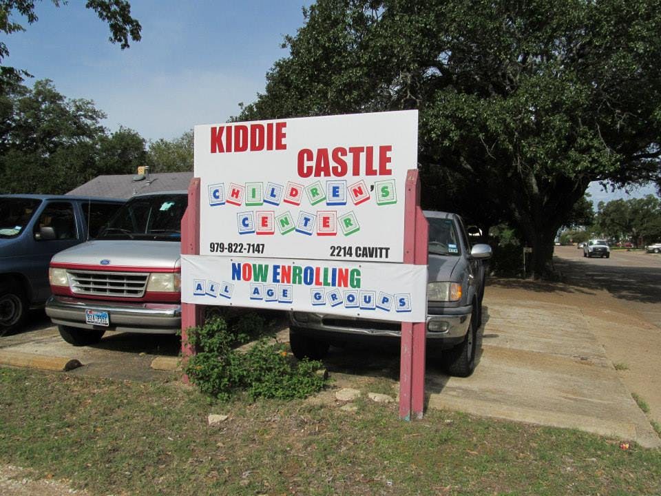Kiddie Castle Children's Center sign with "Now Enrolling"