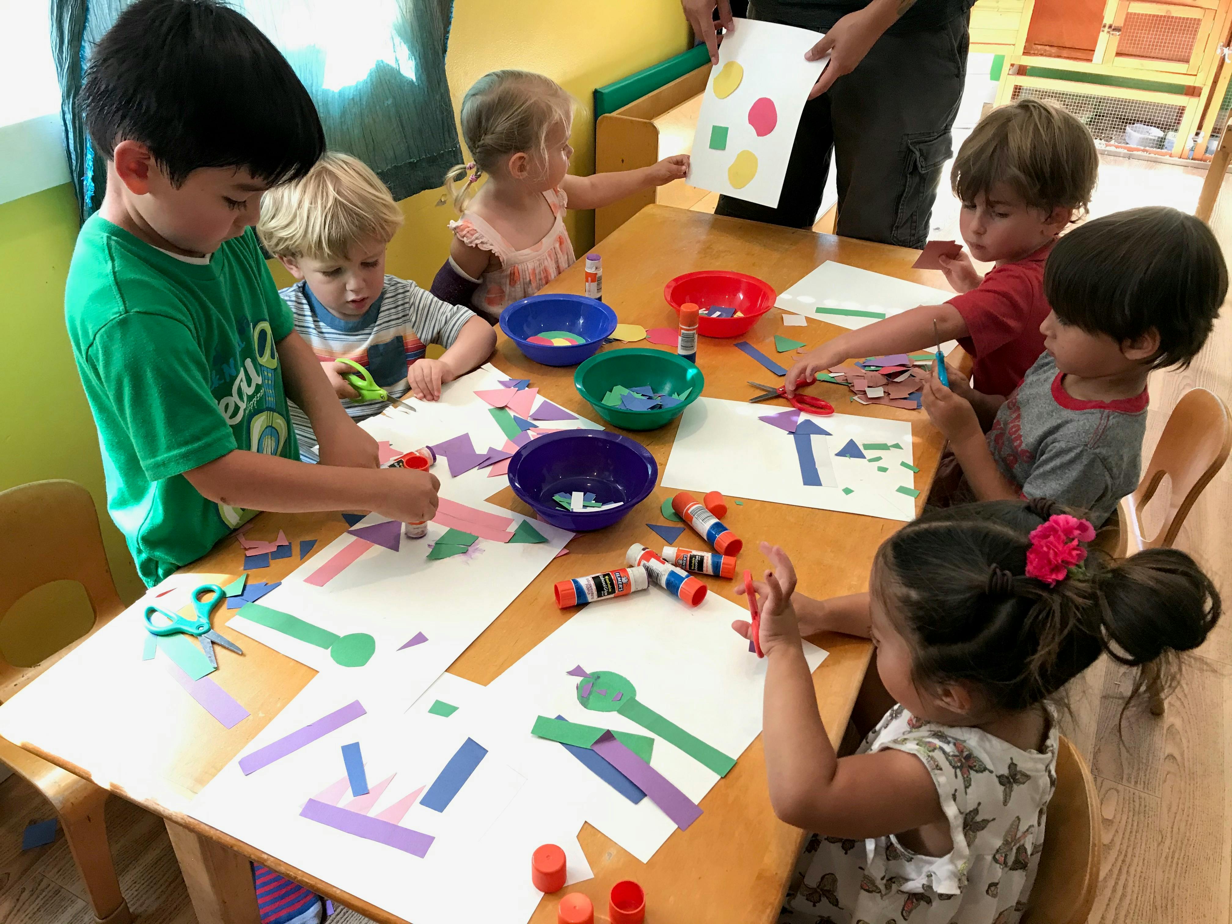 Children doing arts and crafts at a table