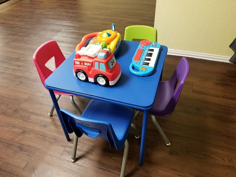 Children's table with chairs and toys