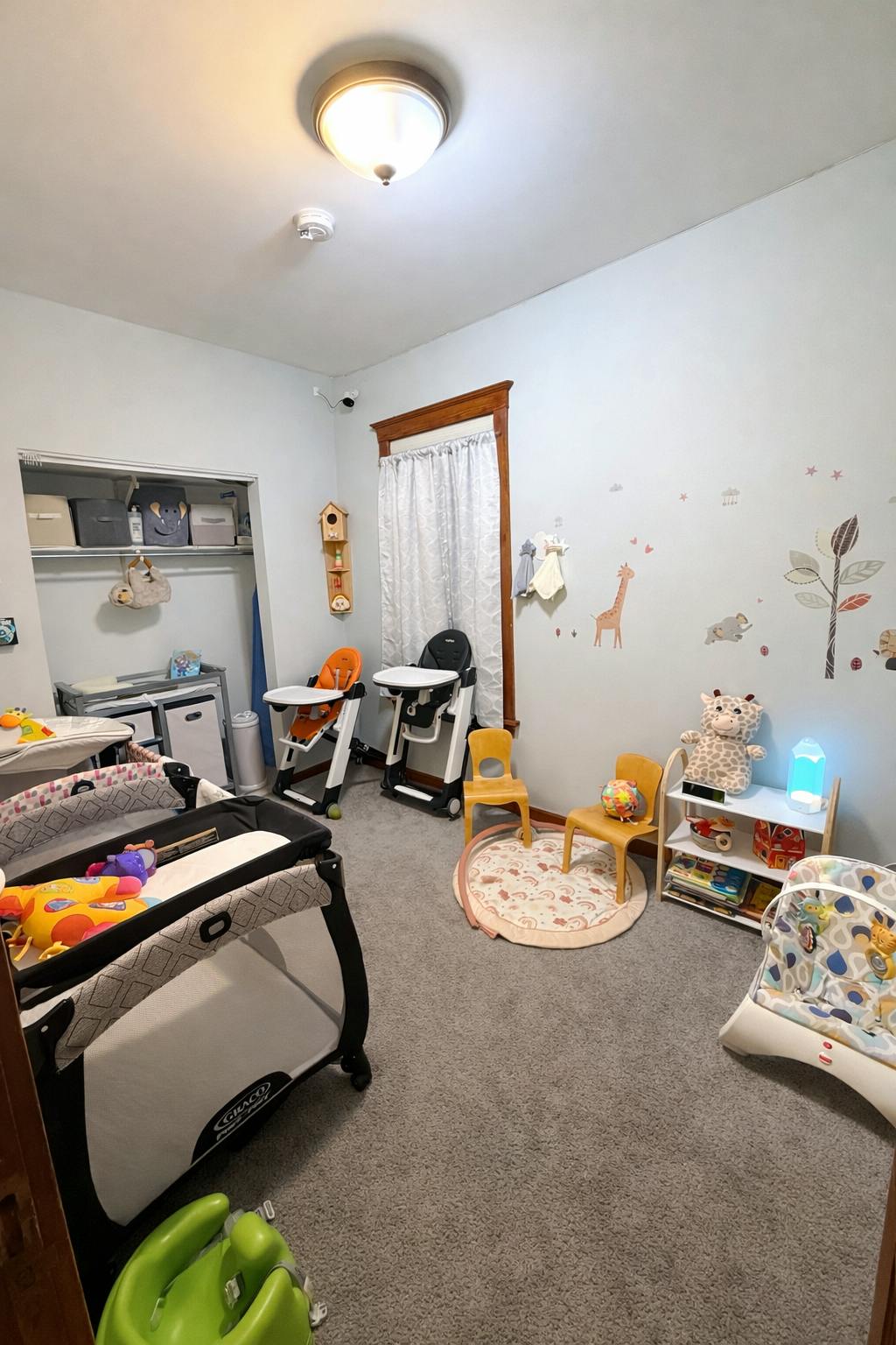 Child bedroom with cribs high chairs and toys