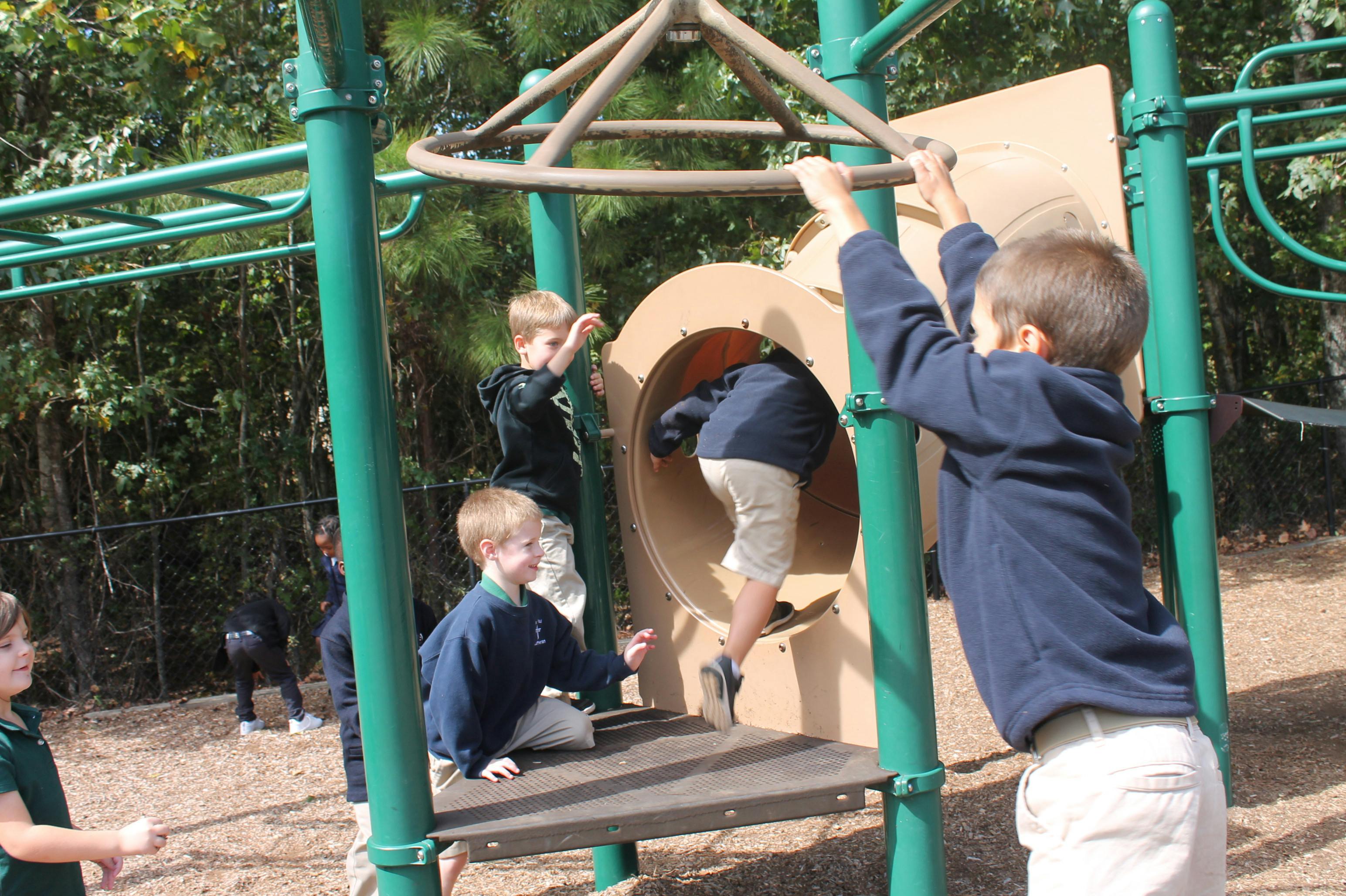 Children playing on a playground structure
