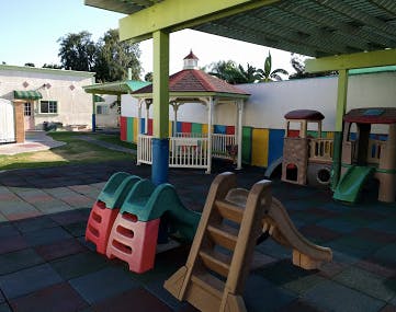 Outdoor playground with slides and a gazebo