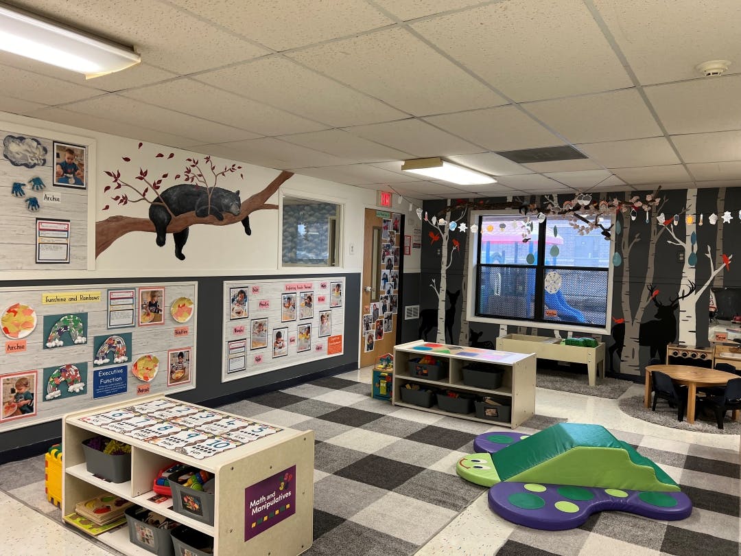 Classroom with animal murals and children's activity displays
