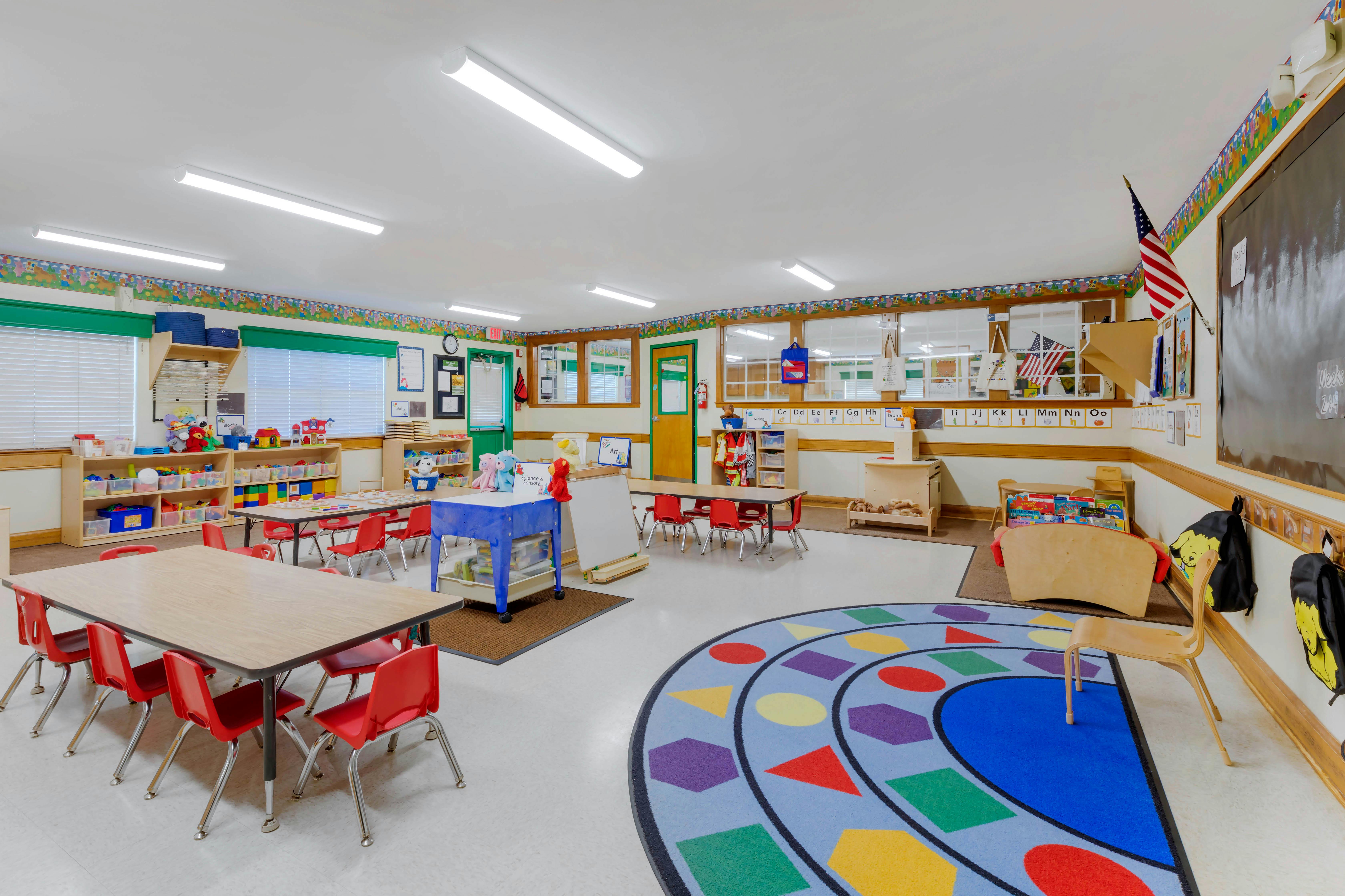 Colorful and organized classroom with small tables and chairs