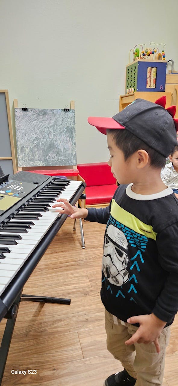 Child playing a keyboard