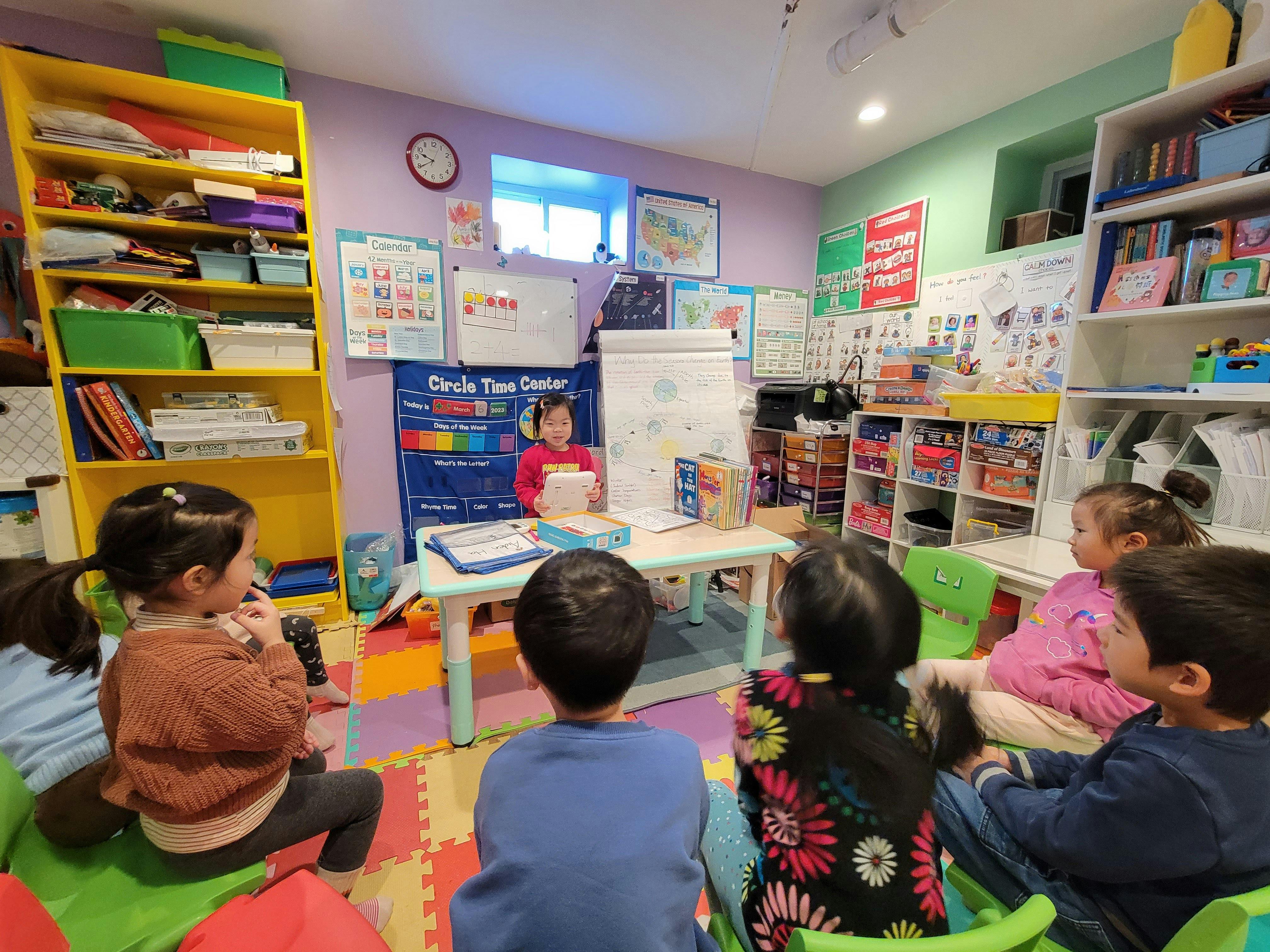 child leading a classroom discussion with other children