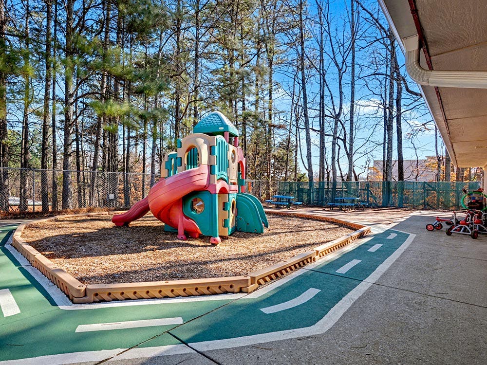Children's playground with colorful play structure and slides